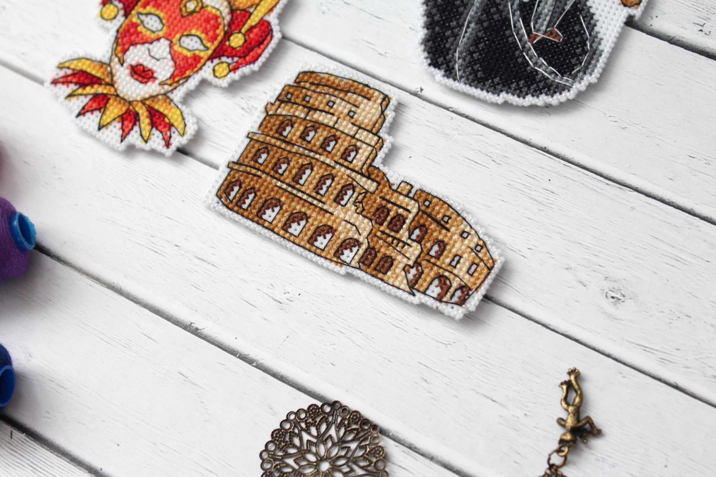 Italy Magnets P-309 / SR-309 Cross Stitch Kit featuring colorful threads and plastic canvas for crafting.